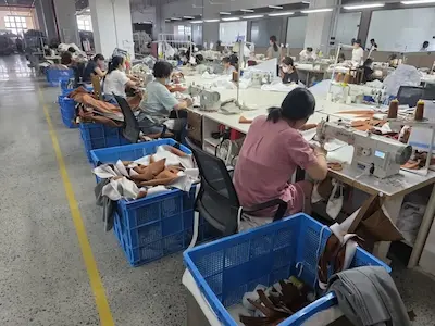 Workers assembling fabric on a factory production line in China